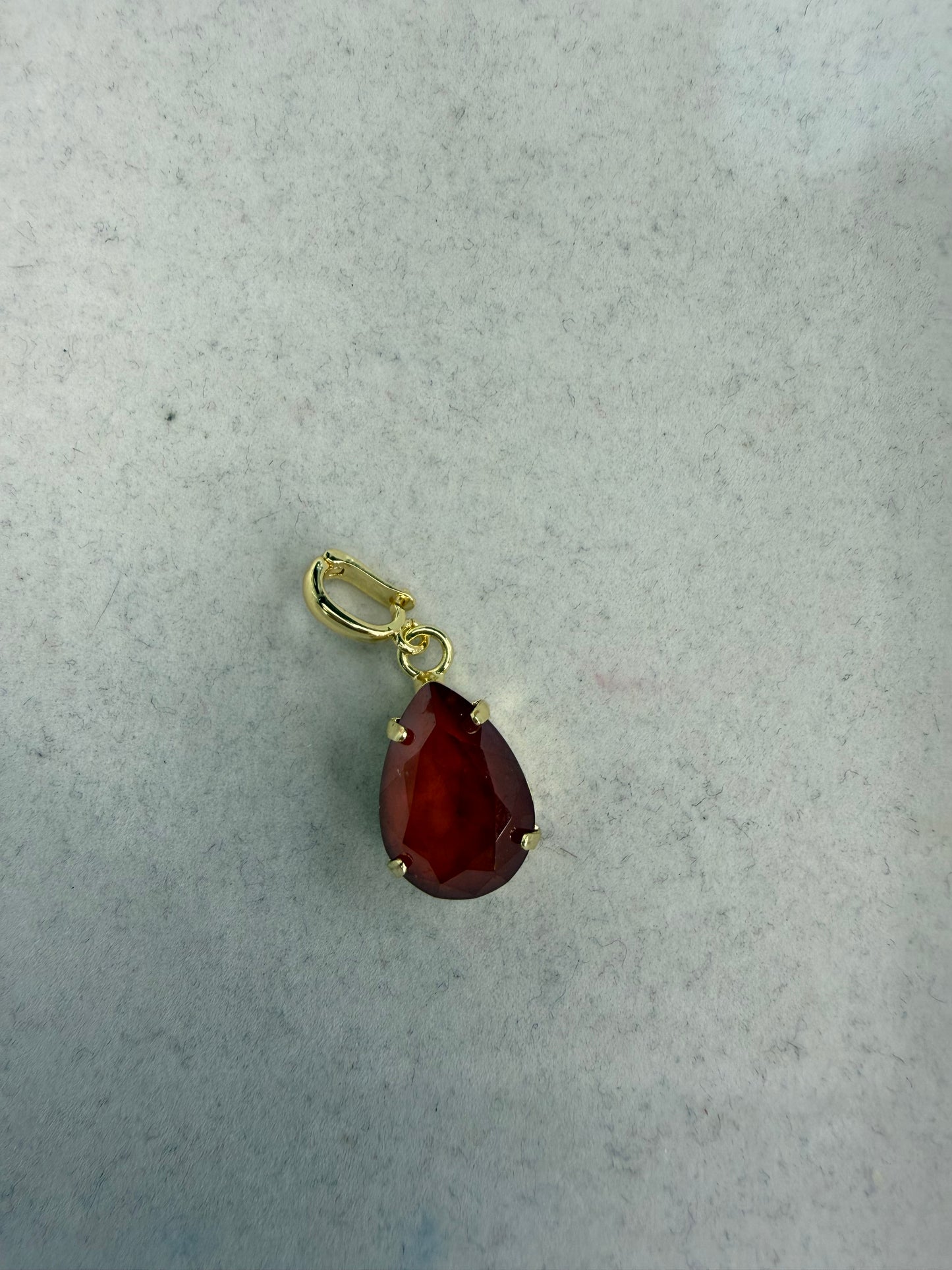 AF Designs gold teardrop charm with faceted cranberry red gemstone and clip bail pendant
