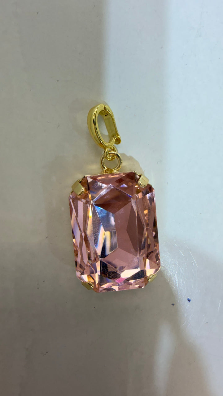 AF Designs rectangular blush pink faceted crystal charm pendant with gold-tone prong setting and spring clasp bail