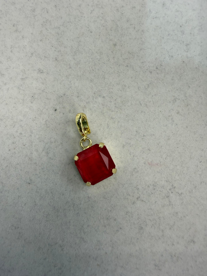 Square cranberry red faceted gemstone charm with gold four-prong setting and hinged clip bail by AF Designs.