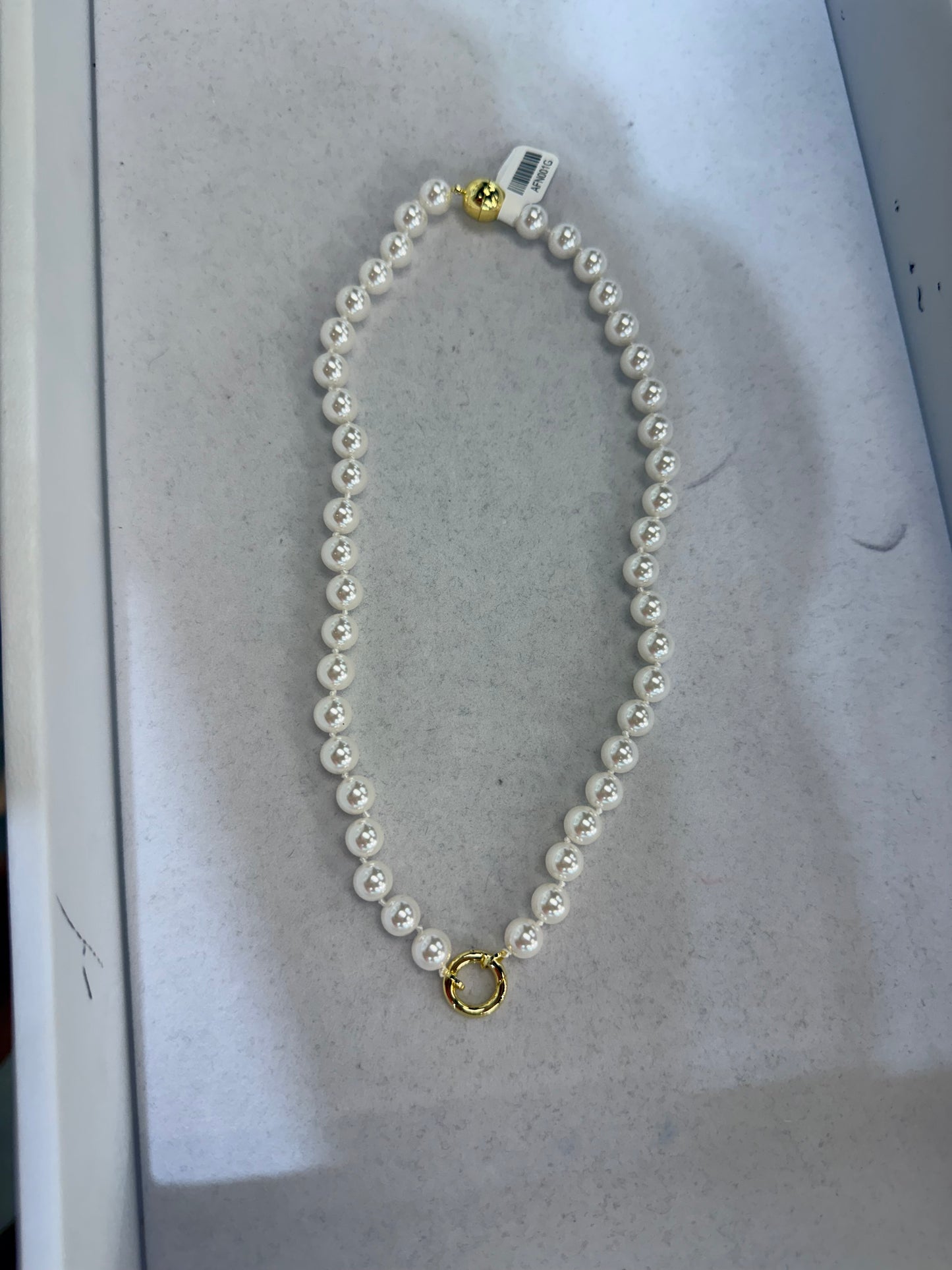 White pearl strand necklace with gold ball clasp and circular pendant holder by AF Designs