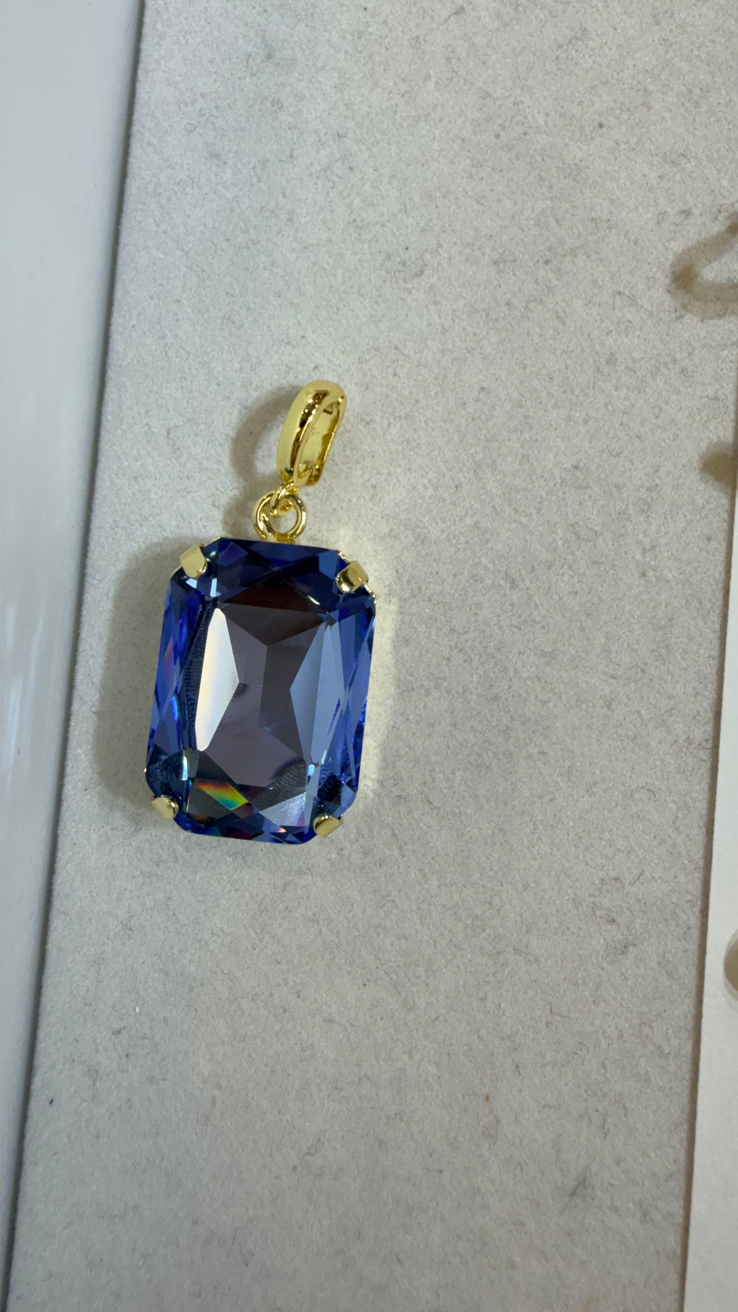 Rectangular faceted blue crystal charm pendant with gold prong setting and bail by AF Designs