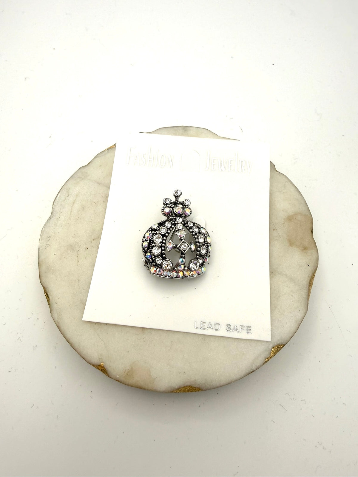 Crown-shaped brooch in antique silver with clear and iridescent AB rhinestones, royal design with openwork detailing