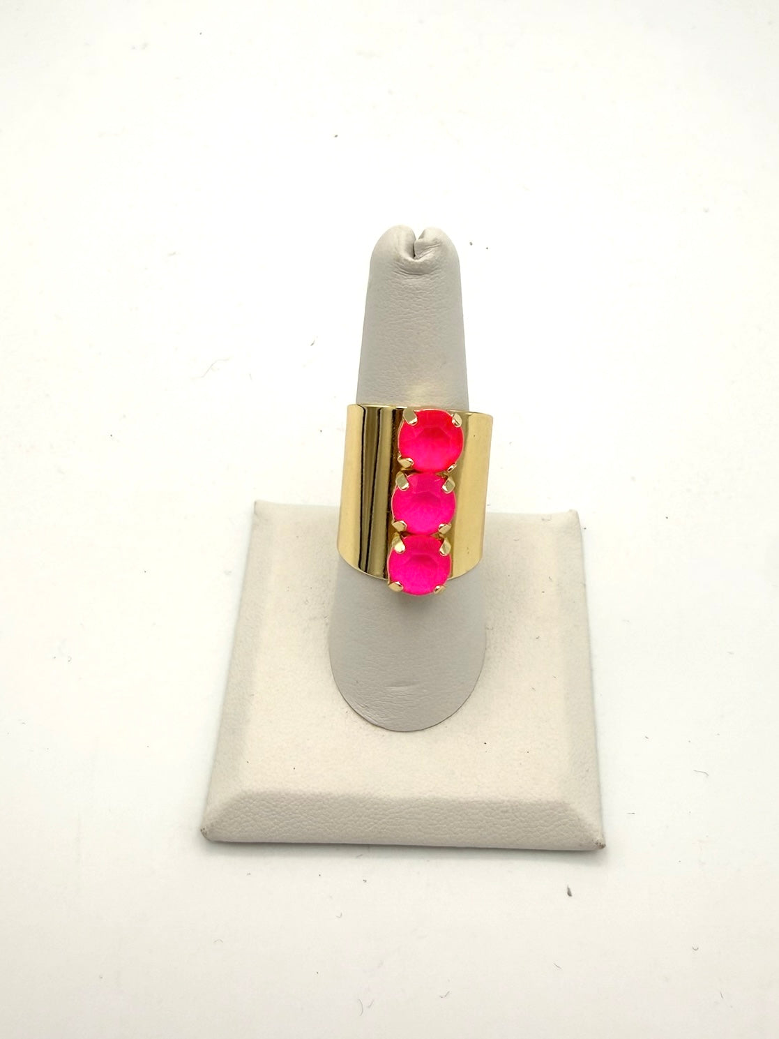 AF Designs Triple Threat Ring: wide gold band with three vertical neon pink round stones in prong settings