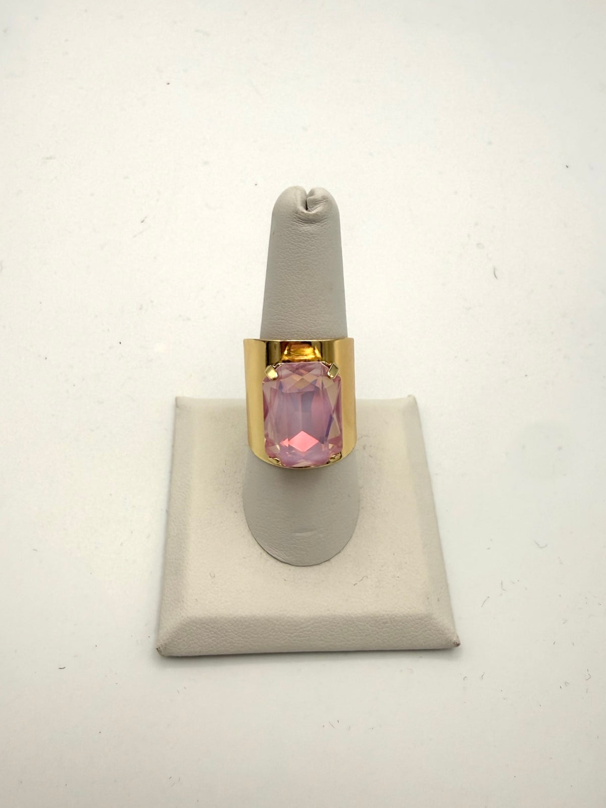 Bold gold wide-band cocktail ring with large cushion-cut pink gemstone in four-prong setting by AF Designs