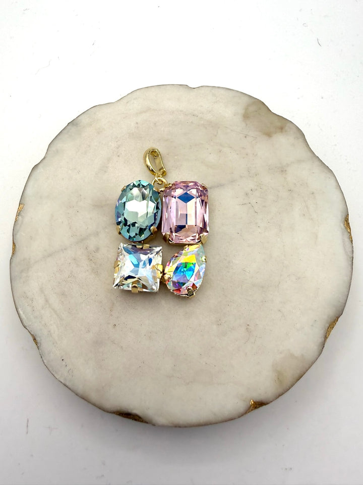 Gold charm pendant with 4 pastel crystals: mint oval, pink cushion, AB square, and AB teardrop stones