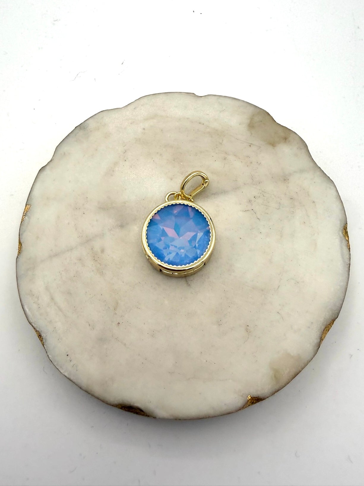 Round gold charm pendant with faceted sky blue opalescent crystal and scalloped bezel by AF Designs