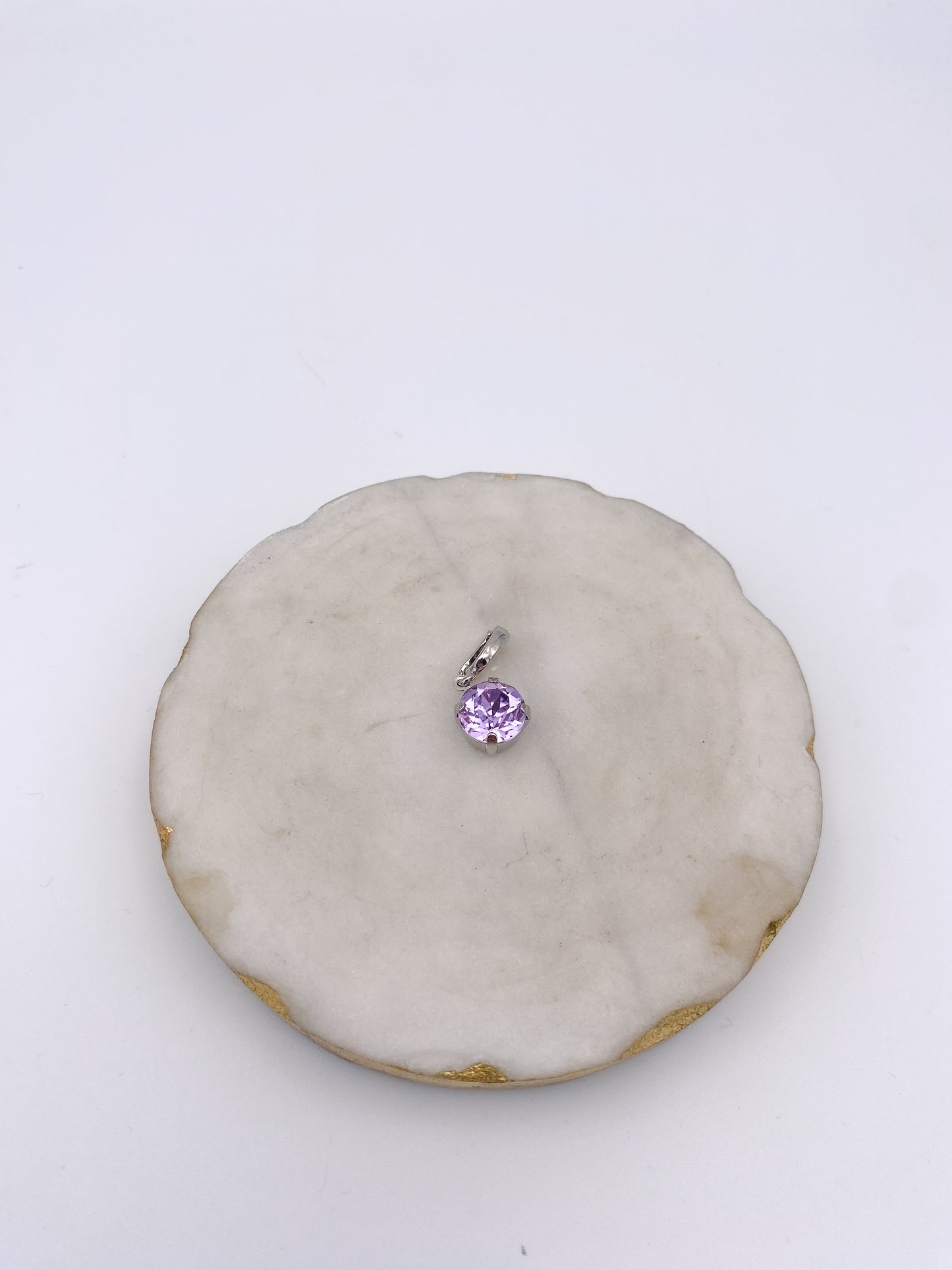Small round lavender gemstone charm pendant with silver prong setting and bail, ideal for necklaces or bracelets.