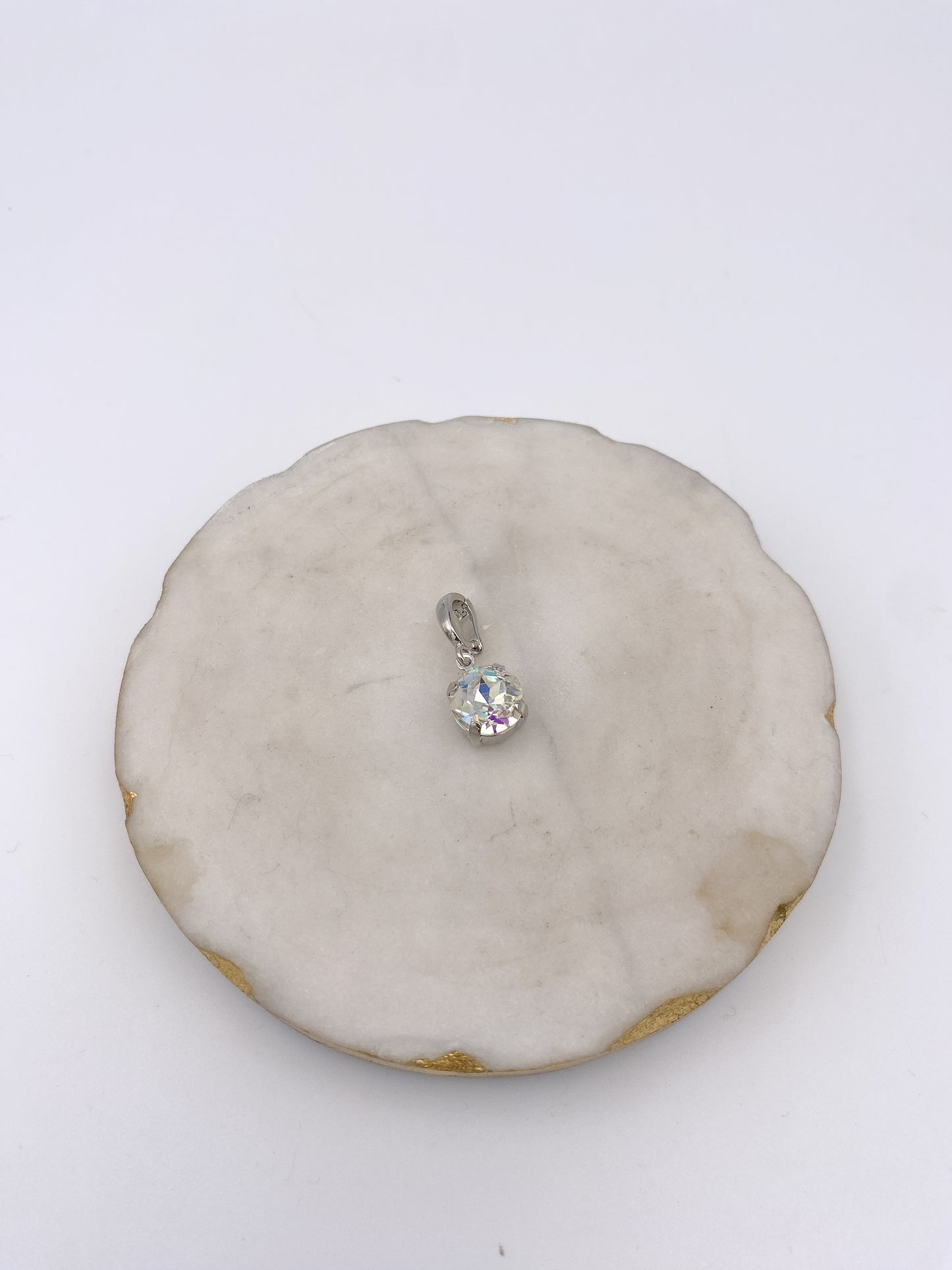 Round clear AB iridescent crystal charm pendant with silver prong setting and bail loop