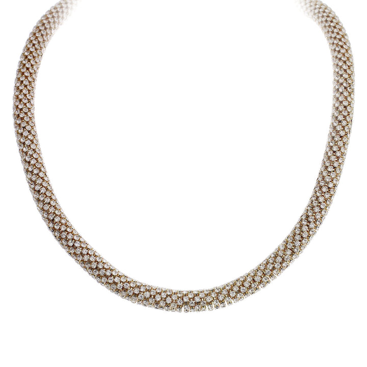 Gold tube necklace densely encrusted with rows of sparkling clear rhinestones in a flexible cylindrical collar style
