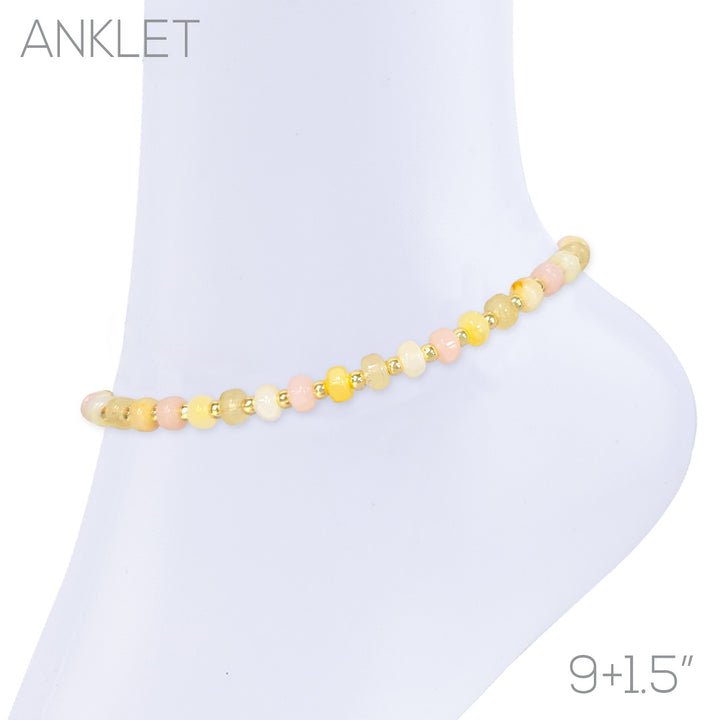 Beaded anklet with pastel yellow, peach, and ivory gemstone beads accented with gold beads, 9+1.5 inch adjustable length.