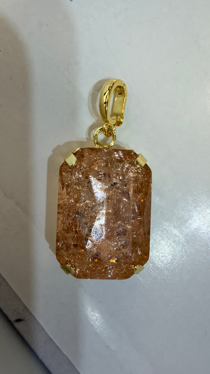 AF Designs rectangular amber crystal pendant with gold prong setting and oval bail, starburst internal effect
