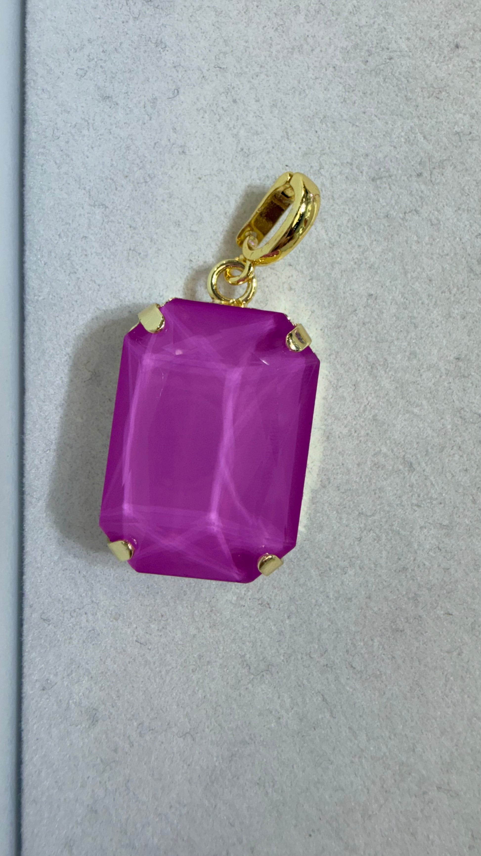 AF Designs rectangular magenta-purple faceted gemstone charm with gold prong setting and lobster clasp