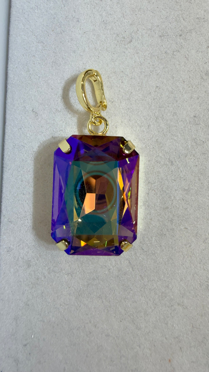AF Designs gold-tone rectangular charm with color-shifting purple, amber, and teal iridescent crystal stone