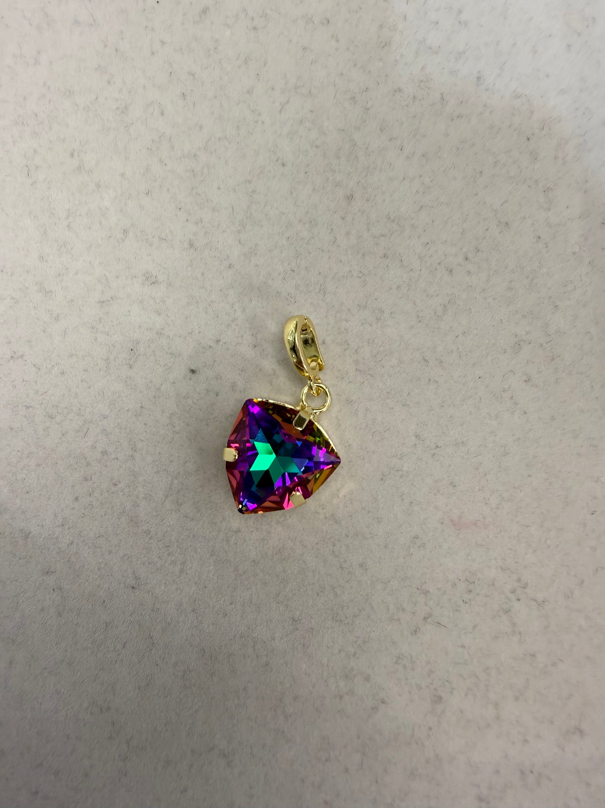 Gold prong-set triangular mystic topaz charm pendant with rainbow iridescent purple, teal, and magenta hues