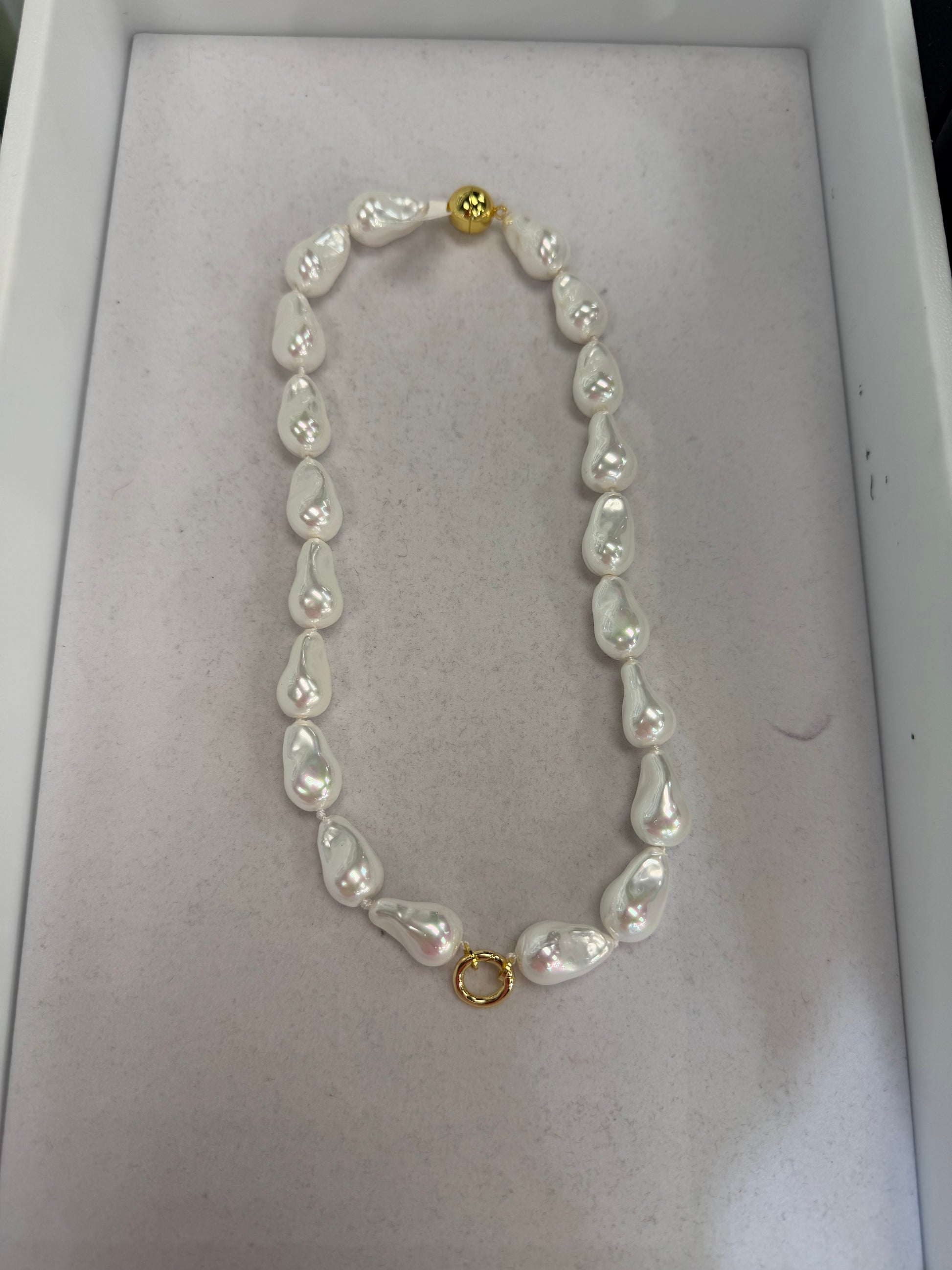 AF Designs Forever Yours baroque pearl necklace with gold clasp, featuring large lustrous white pearls with pink overtones