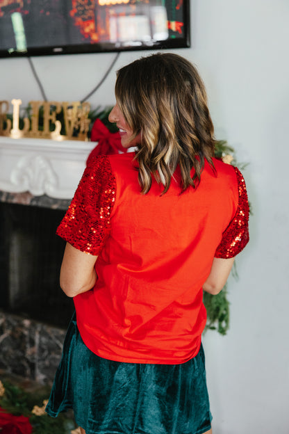 Making Spirits Bright Top by Grace + Emma, top with red and gold sequin puff sleeves and beaded cocktail glass motifs