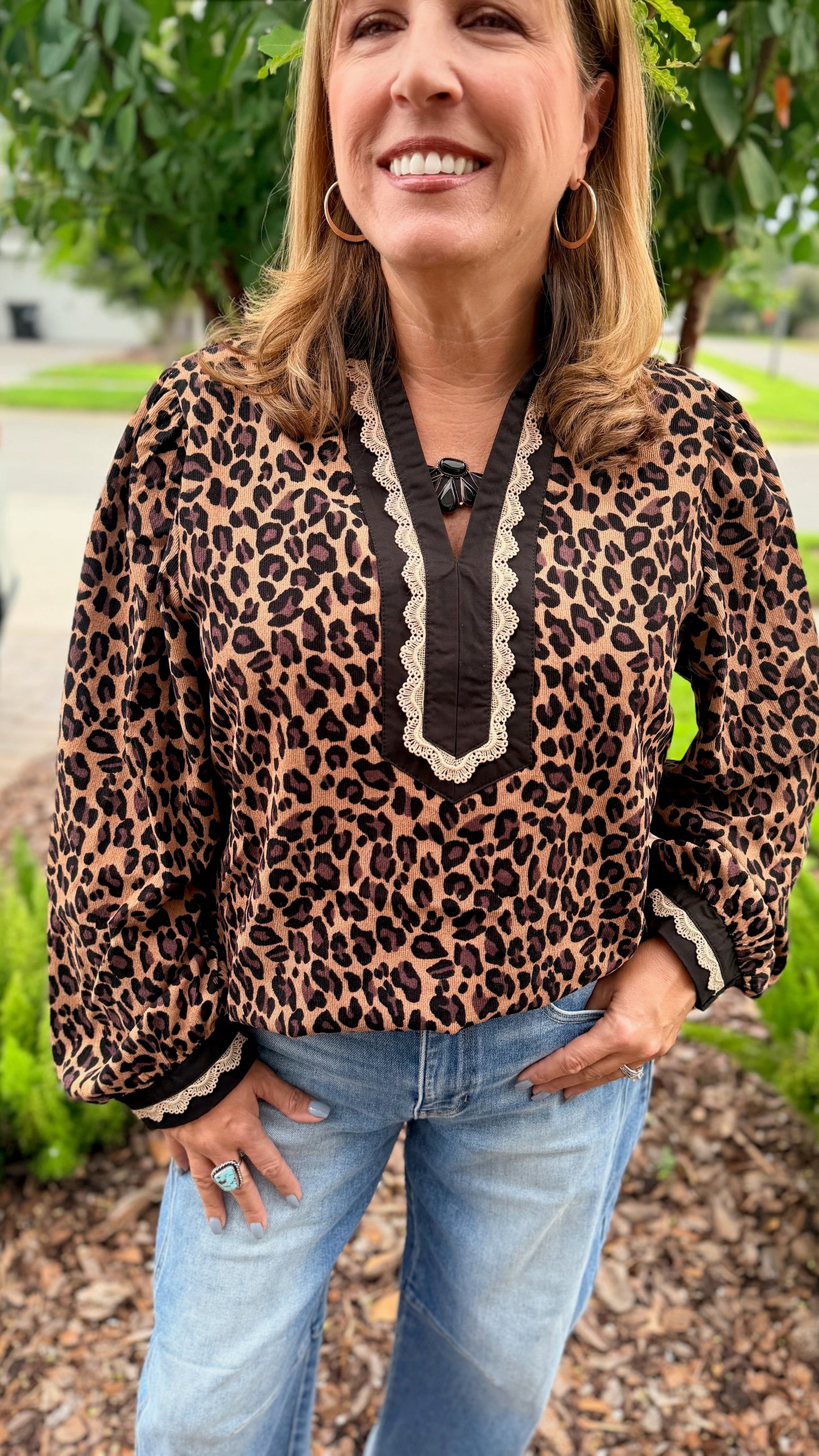 Jodifl Wild Card Top: leopard print blouse with cream lace V-neck bib detail and puff sleeves