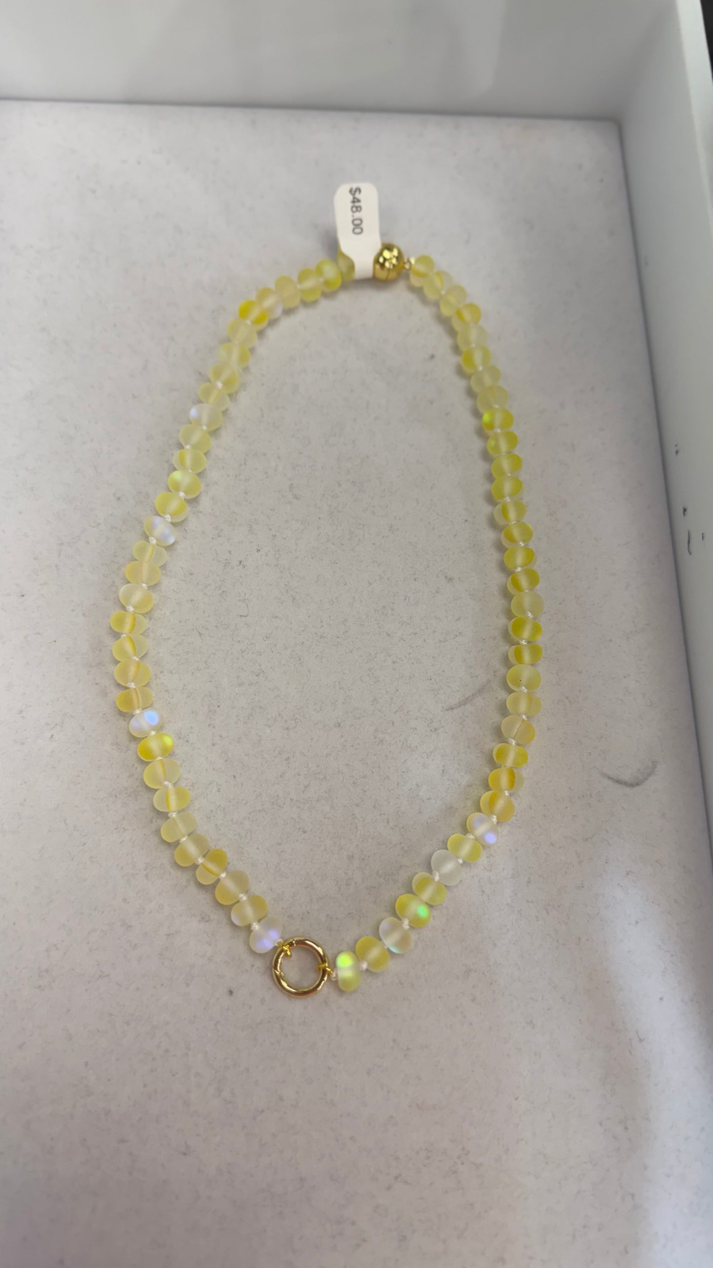 AF Designs Little Secret Necklace in yellow buttercup matte iridescent beads with gold spring clasp.