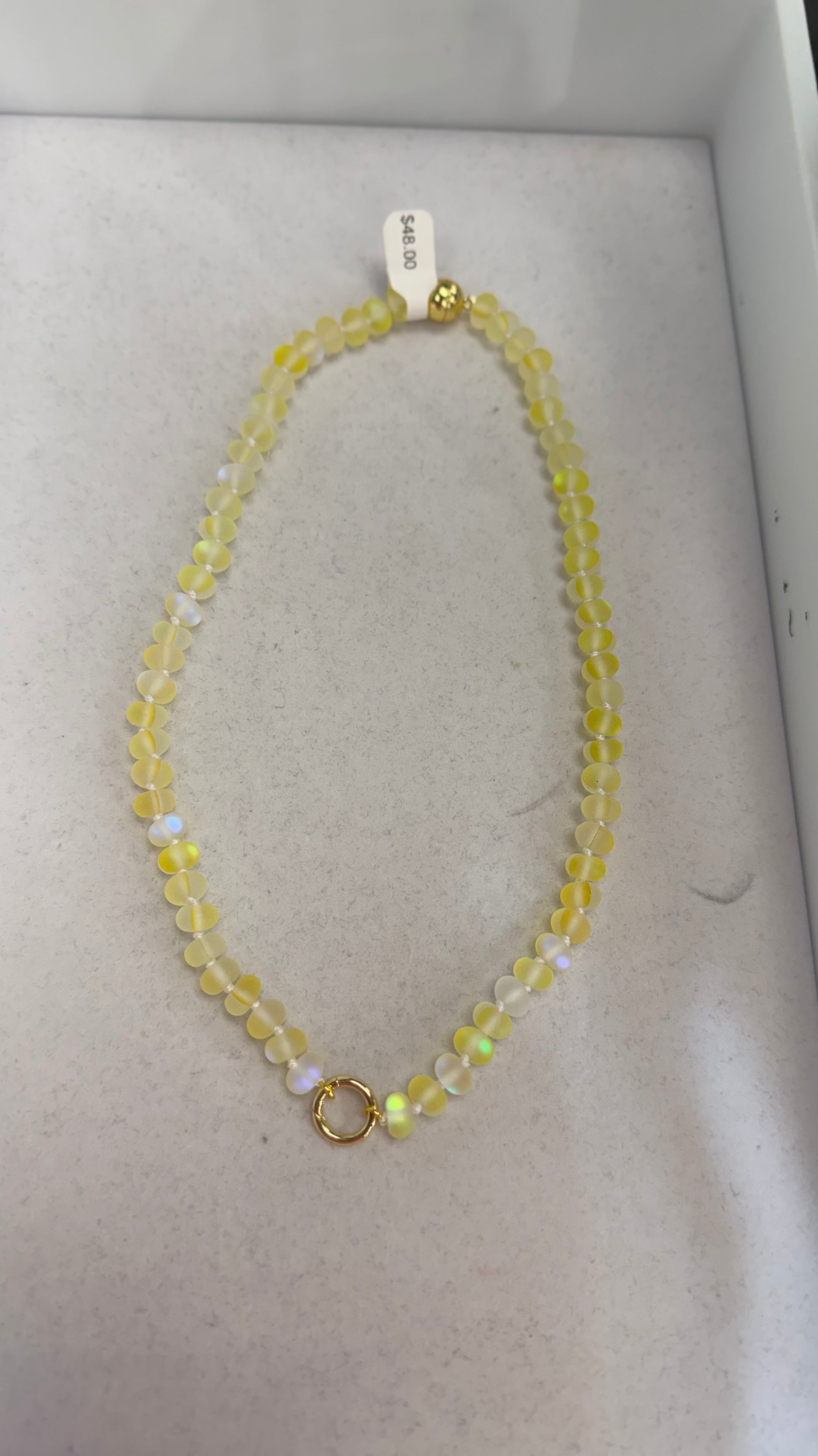 AF Designs Little Secret Necklace in yellow buttercup matte iridescent beads with gold spring clasp.