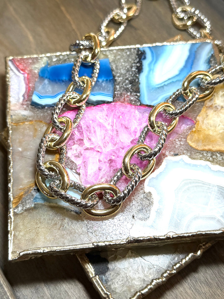 AF Designs Good Company two-tone chunky chain necklace with alternating gold and twisted silver links on agate display