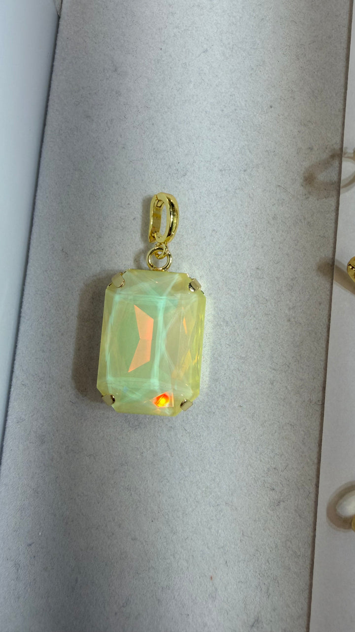 AF Designs rectangular creamy opal iridescent faceted charm pendant with gold prong setting and bail