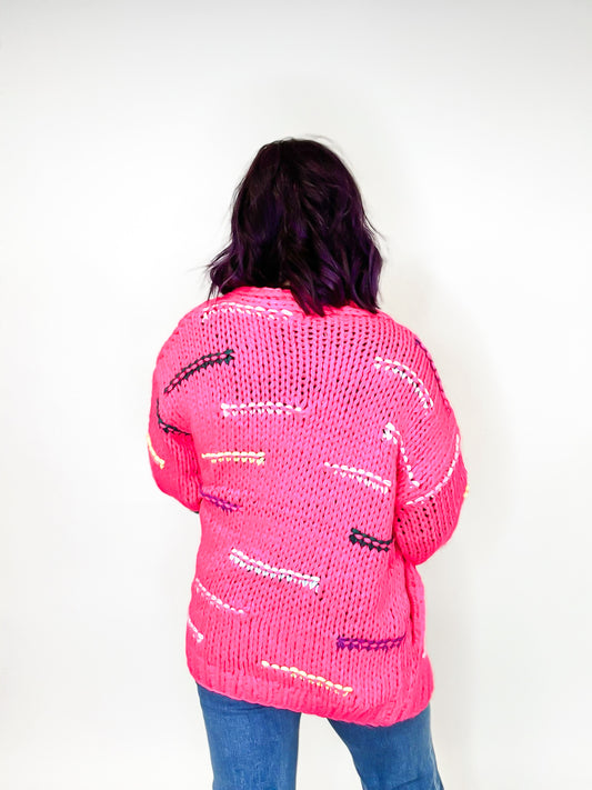 Cardigan à fils rose vif