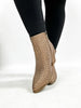 Les bottes en bronze de Corky, venez les chercher