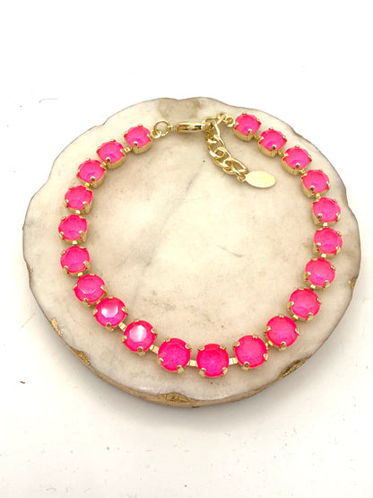 AF Designs gold tennis anklet with vibrant hot pink round crystal stones and adjustable extender chain.
