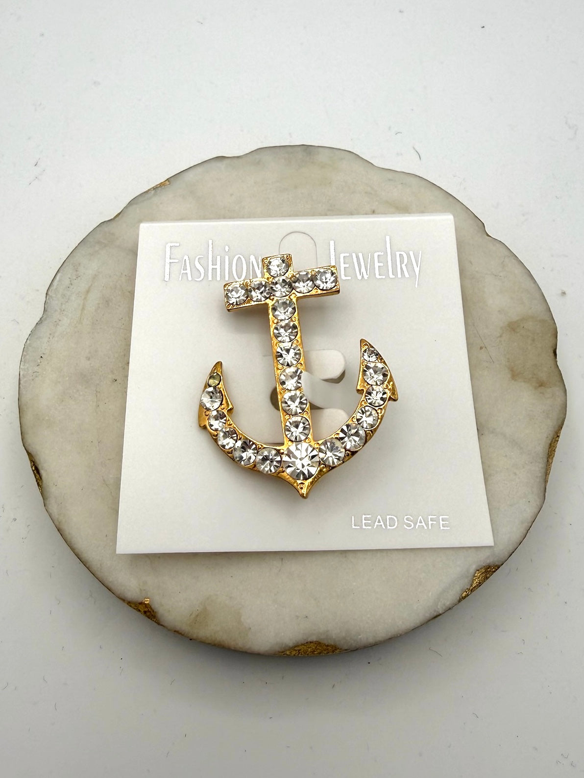 Gold-tone nautical anchor brooch fully encrusted with sparkling clear rhinestones, lead-safe fashion jewelry