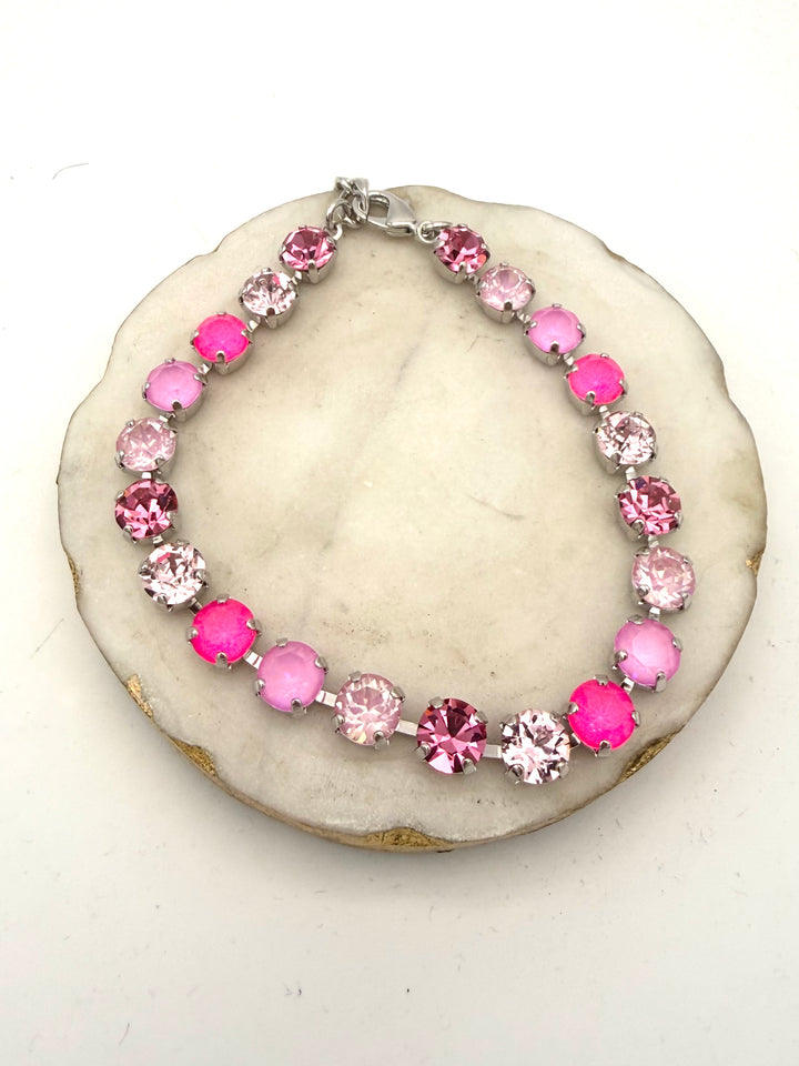 AF Designs silver tennis bracelet with mixed pink crystals including hot pink, blush, and rose stones