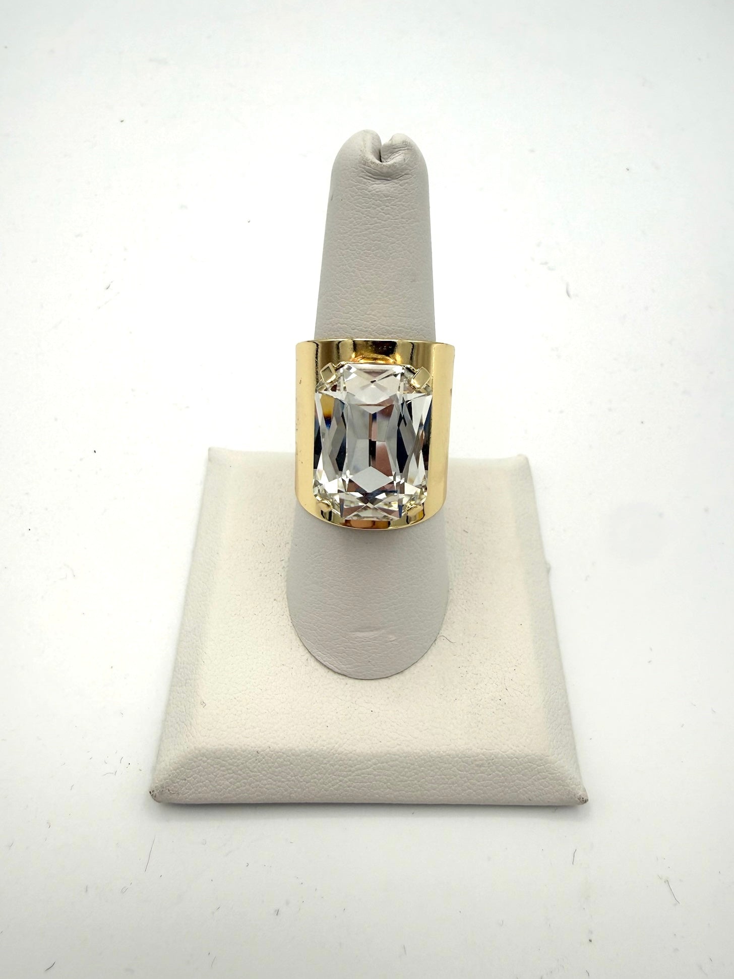 AF Designs Let's Party Ring: large emerald-cut clear crystal on a wide polished gold-tone band statement cocktail ring