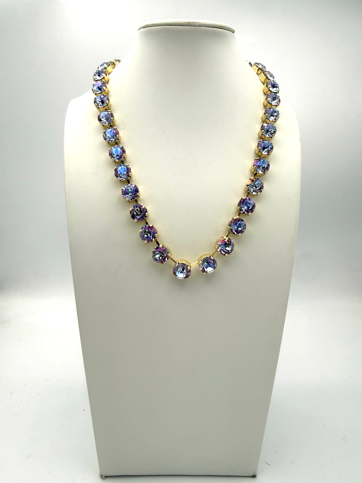AF Designs Fifth Avenue Necklace with iridescent steel blue and violet crystals in gold prong settings