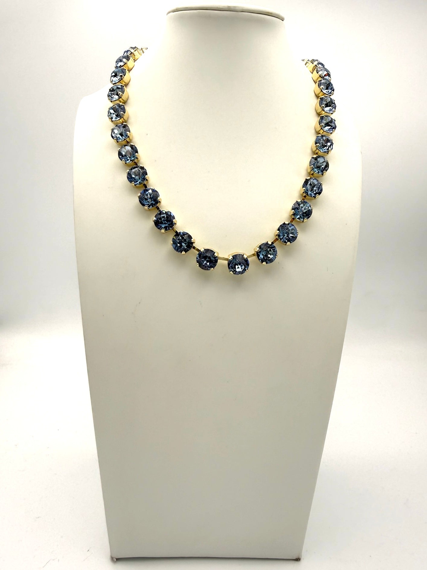 AF Designs Fifth Avenue tennis necklace with denim blue round crystals in gold prong settings, collarbone length