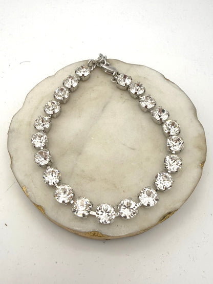Silver tennis anklet with large clear crystal rhinestones in prong settings, lobster clasp closure