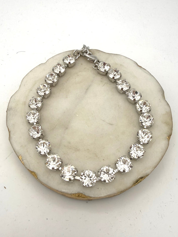 Silver tennis anklet with large clear crystal rhinestones in prong settings, lobster clasp closure
