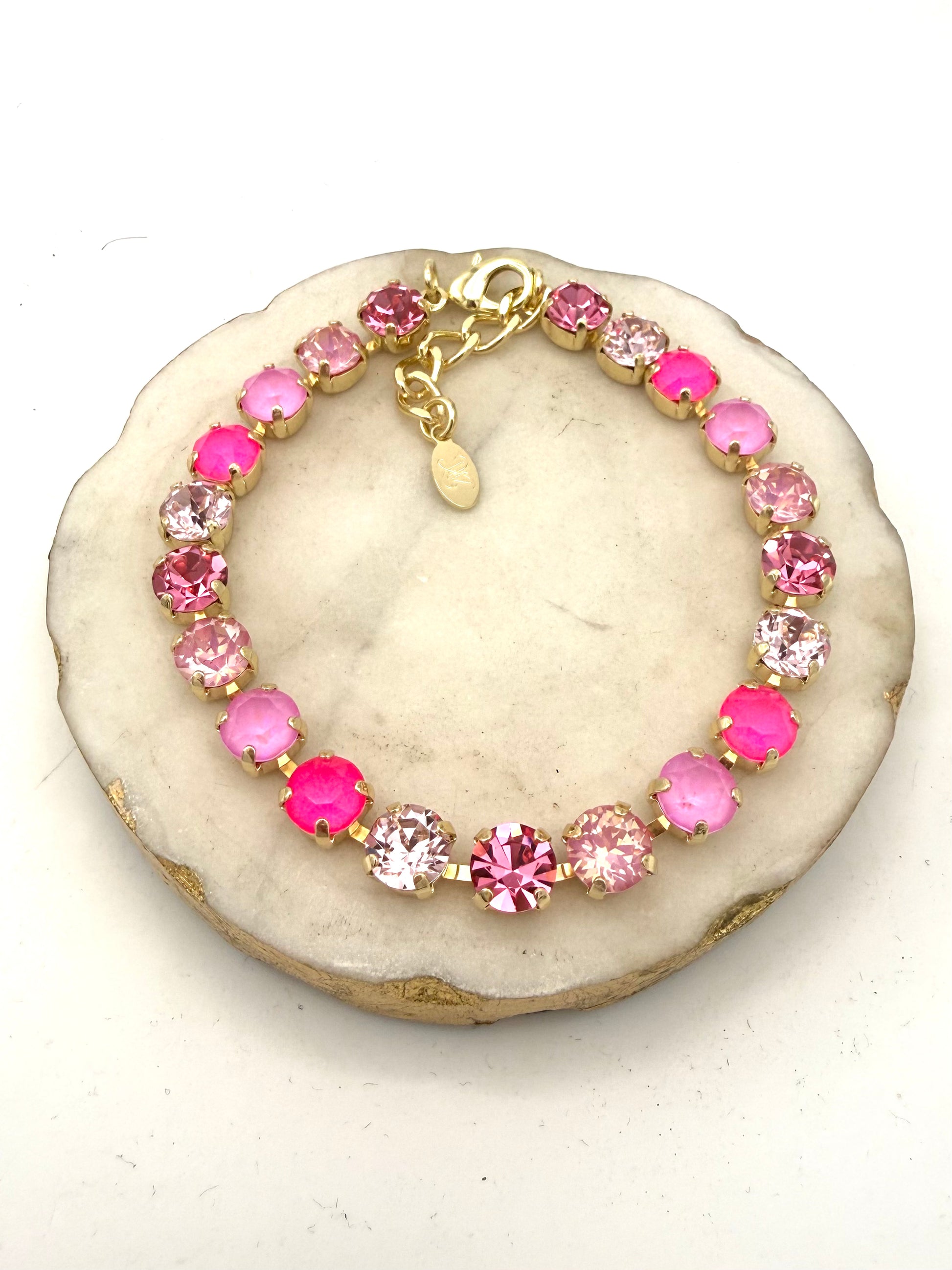 AF Designs gold tennis bracelet with mixed pink crystals in neon, blush, rose, and frosted tones with lobster clasp