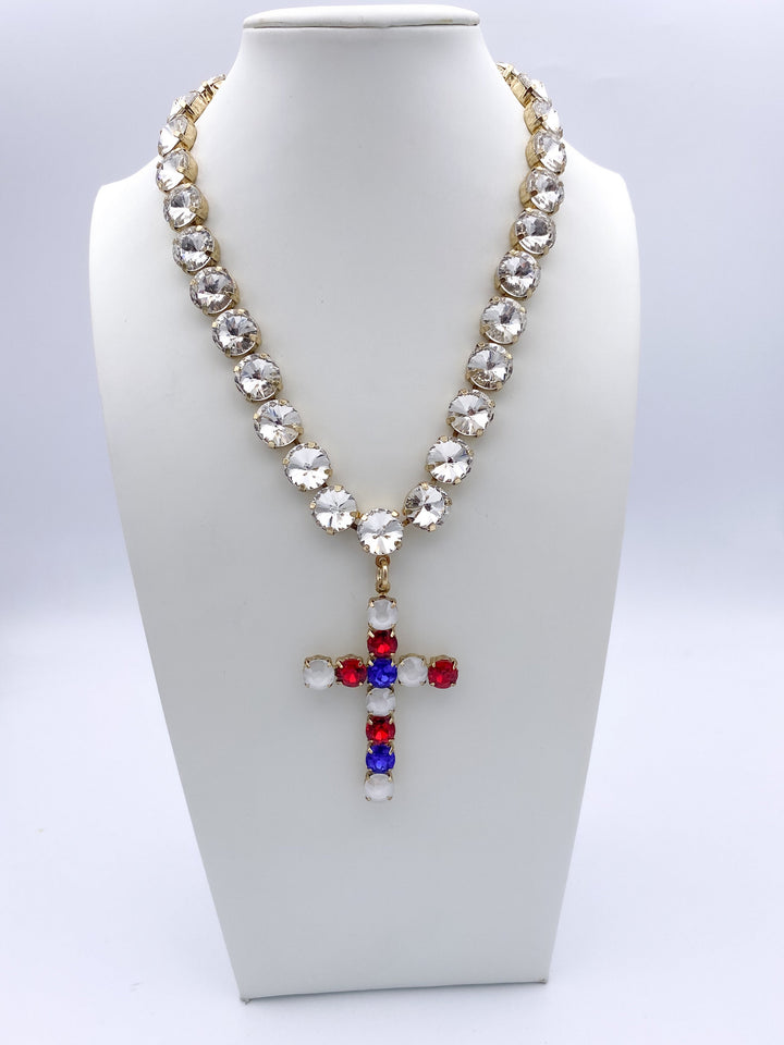 Gold-tone statement necklace with clear crystals and patriotic red, white and blue cross pendant