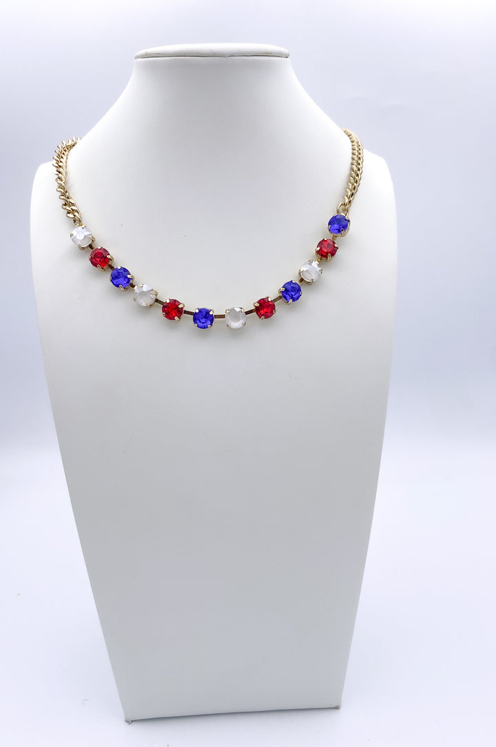 Gold chain necklace with alternating red, white, and blue gemstones in patriotic 4th of July pattern
