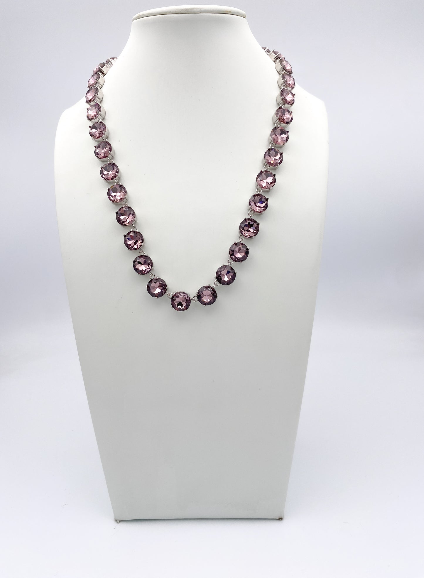 AF Designs Making Moves Necklace featuring violet-pink faceted crystals in silver collet settings in a rivière style.