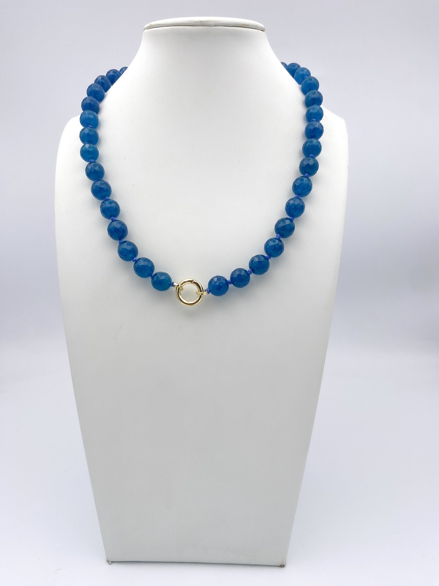 AF Designs Blue Lagoon faceted cobalt blue beaded necklace with gold circular clasp on white bust display