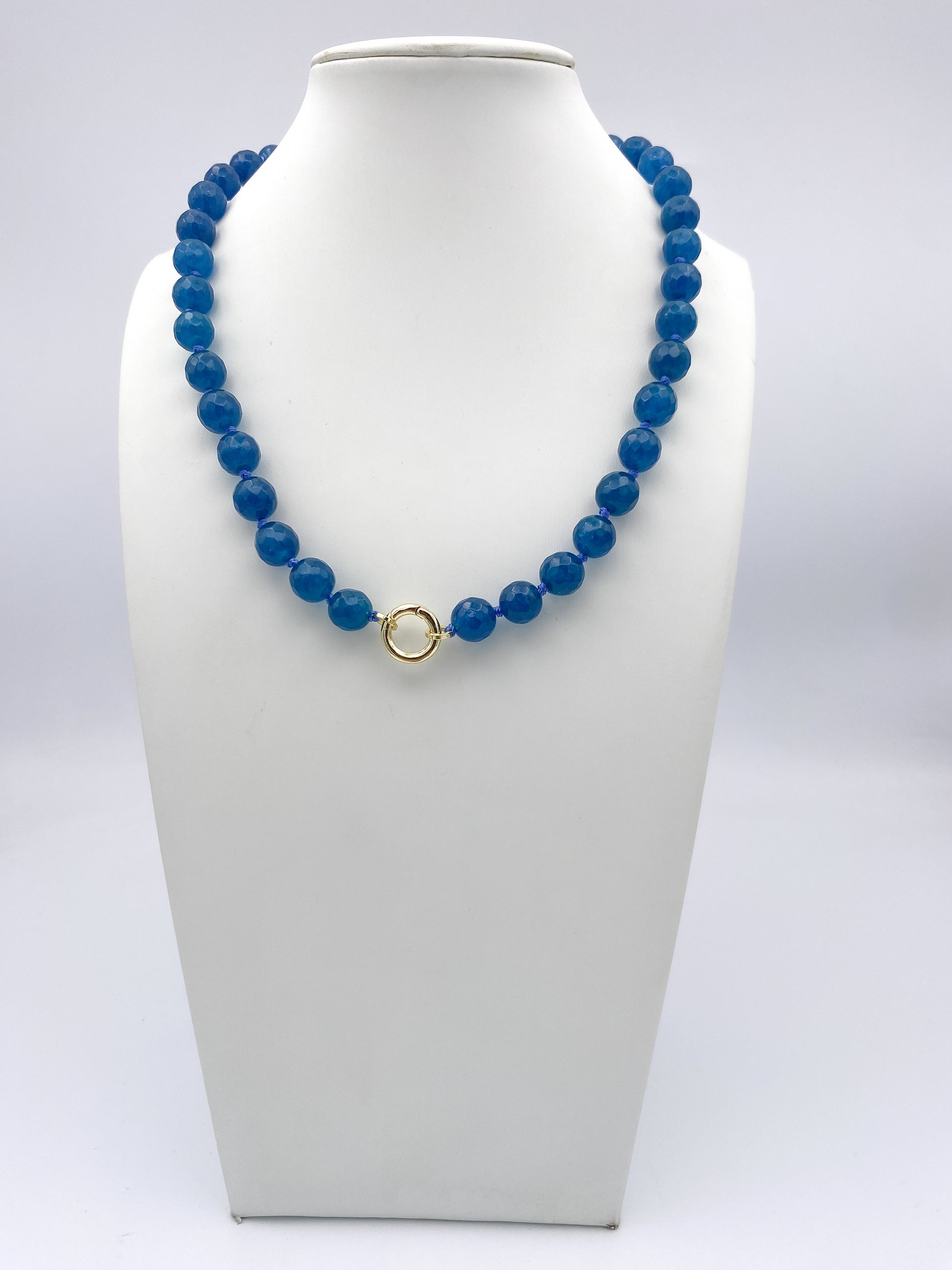 AF Designs Blue Lagoon faceted cobalt blue beaded necklace with gold circular clasp on white bust display