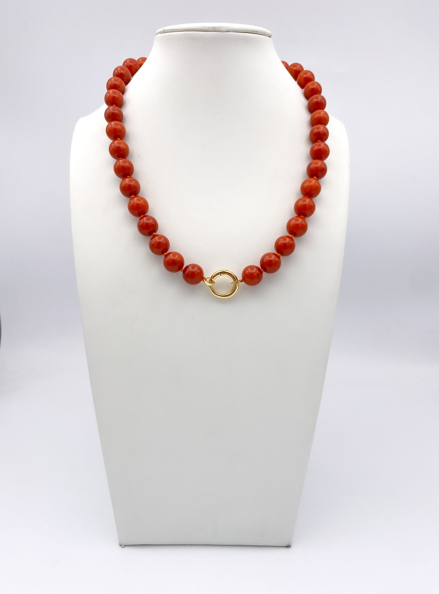 AF Designs Terracotta Glow Necklace with polished orange coral-style beads and gold circular front clasp