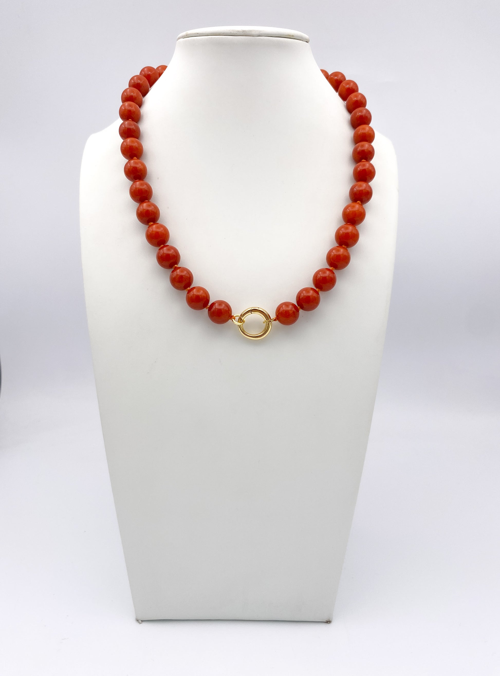 AF Designs Terracotta Glow Necklace with polished orange coral-style beads and gold circular front clasp