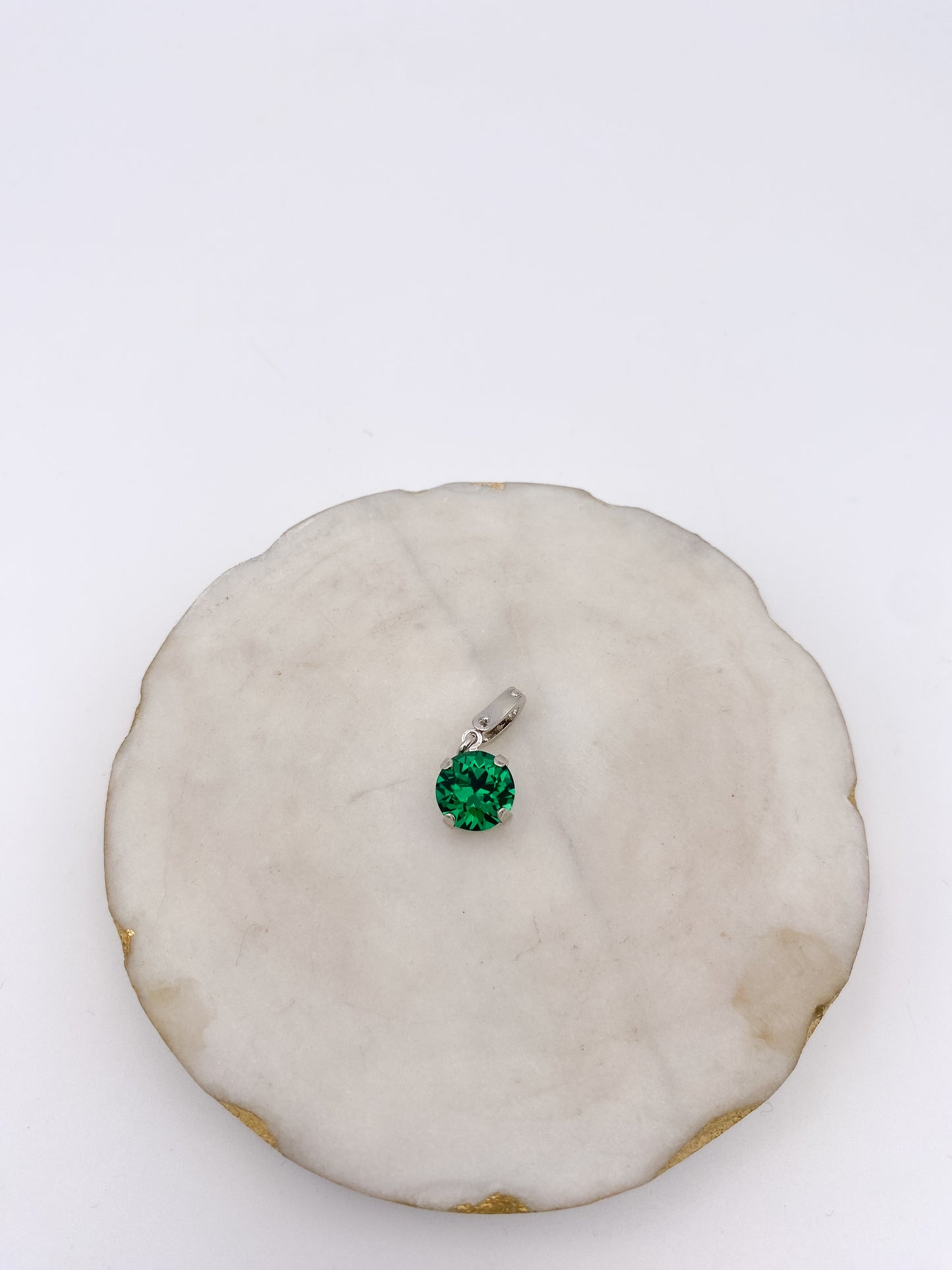 Round emerald green gemstone solitaire pendant charm with silver prong setting and bail loop