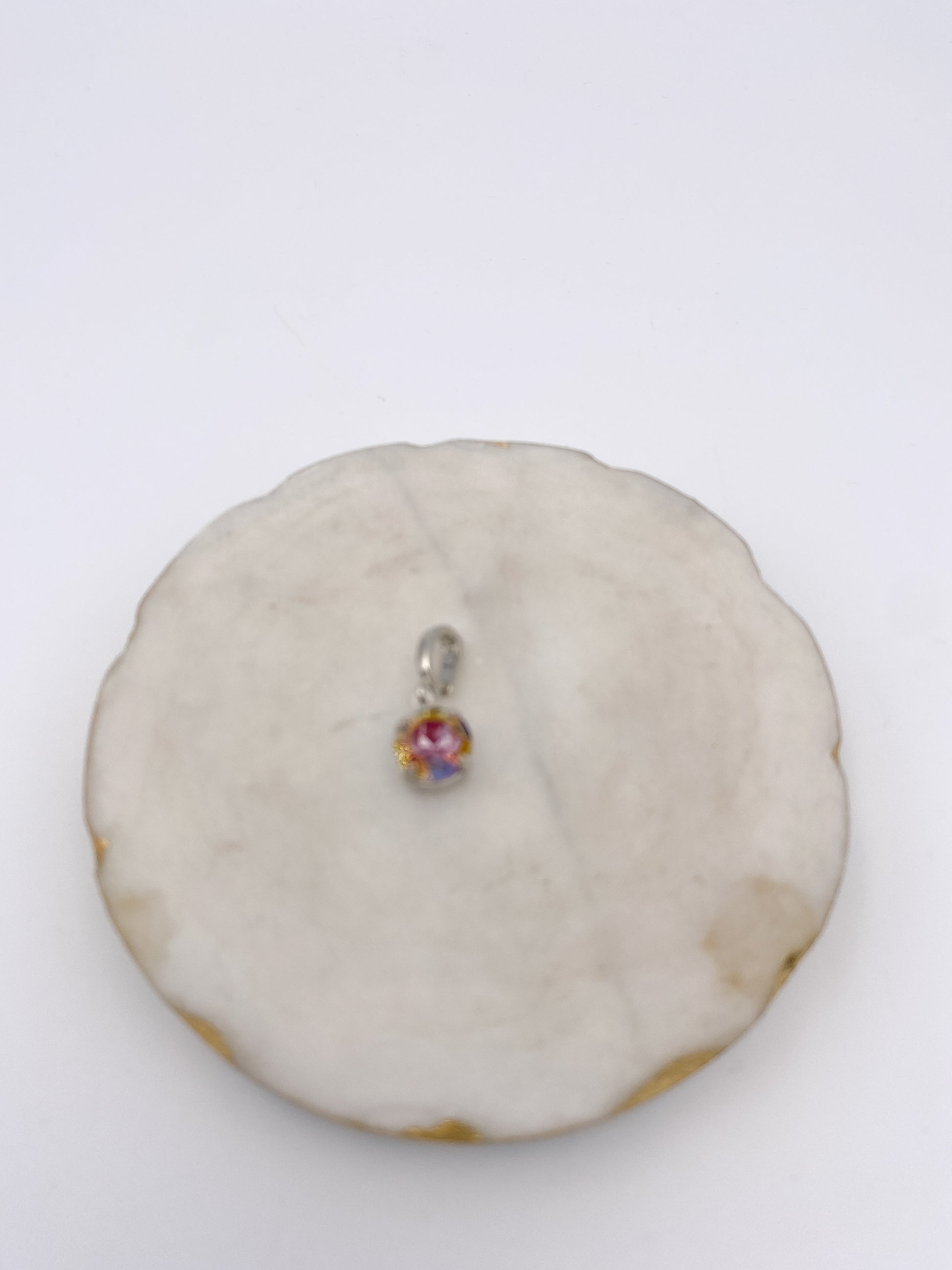 Tiny round pink Aurora Borealis iridescent crystal charm pendant with silver bail connector