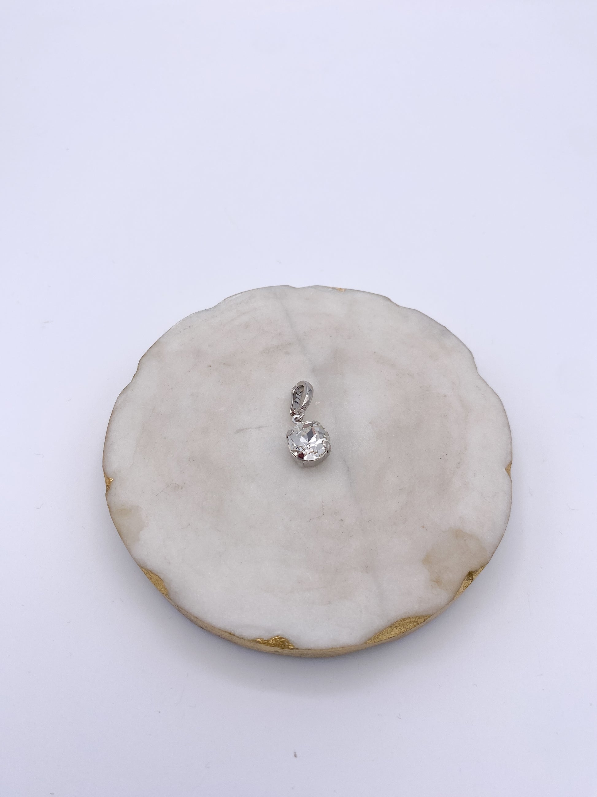 Dainty round clear crystal charm with silver bezel setting and lobster clasp bail by AF Designs