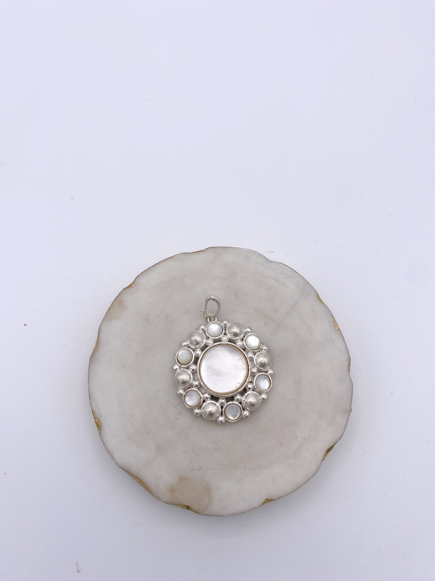 AF Designs sterling silver circular pendant with central pearl cabochon surrounded by smaller pearls and silver bead accents