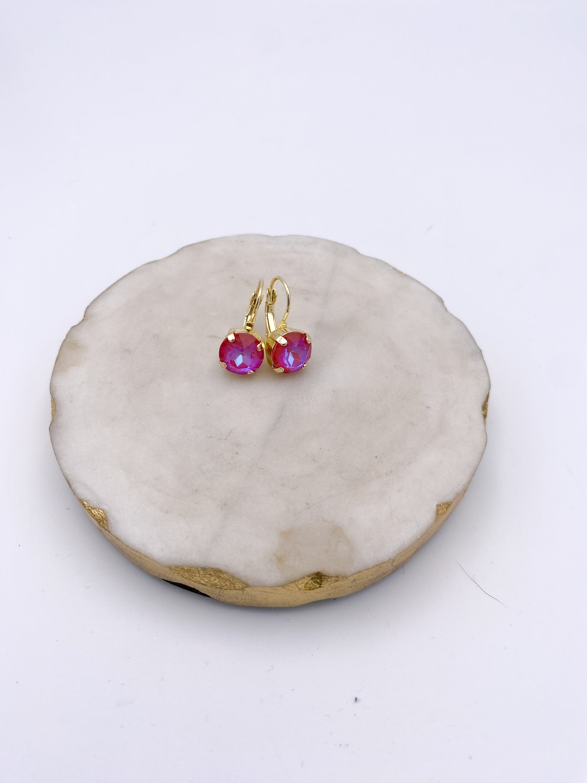 Gold lever-back drop earrings with iridescent raspberry pink faceted crystal stones by AF Designs.