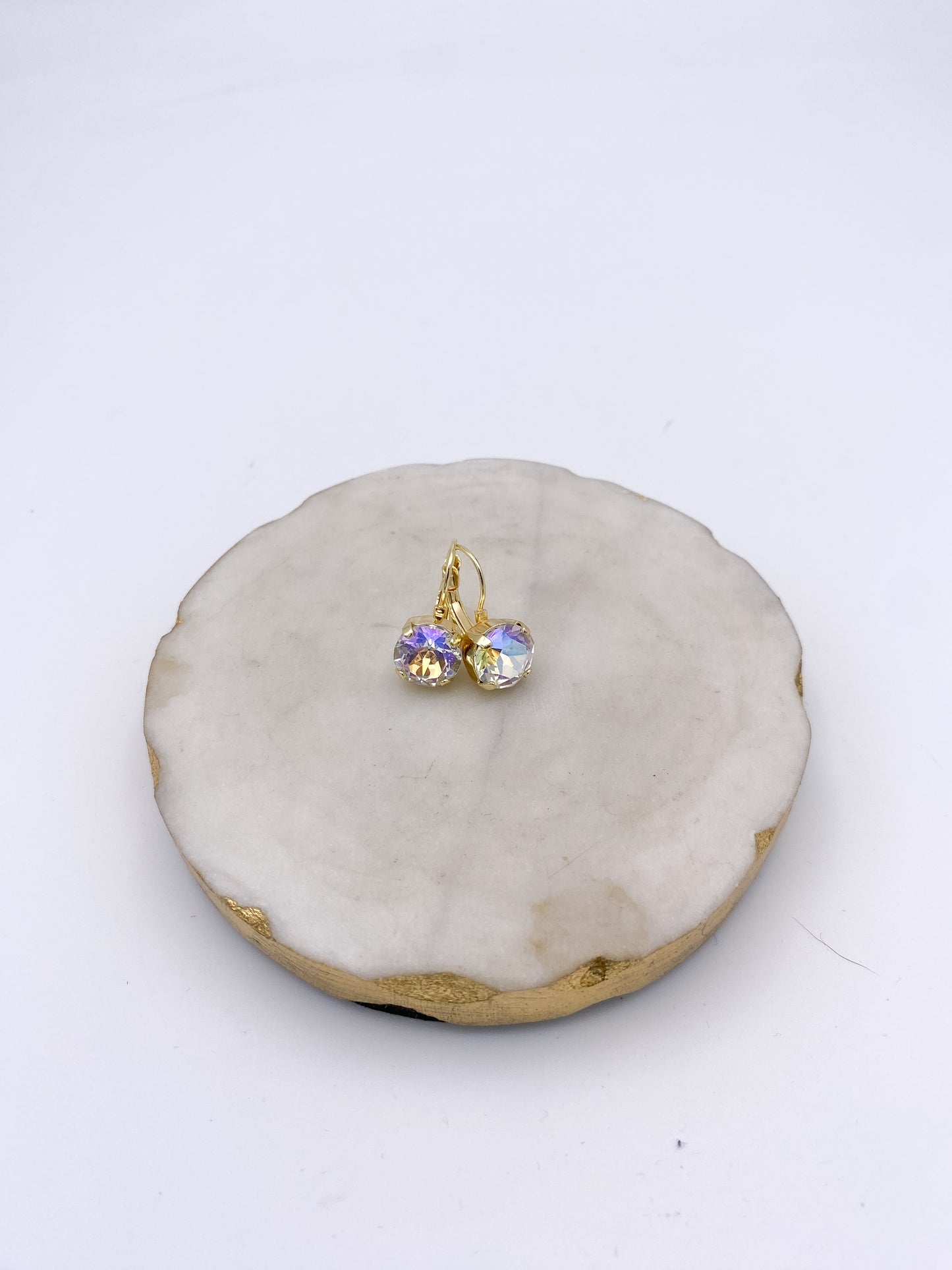 Gold lever-back drop earrings with iridescent cushion-cut AB crystal stones reflecting rainbow hues