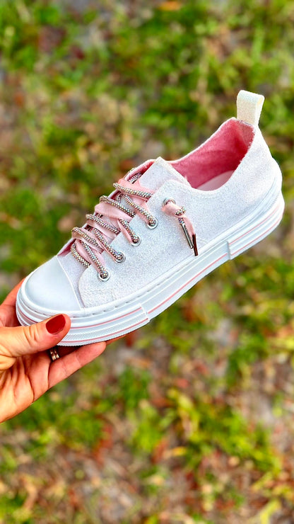Very G white glitter low-top sneaker with rhinestone laces, pink satin ribbon ties, and pink interior lining